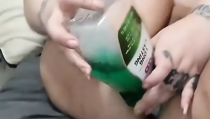 Hot Milf Attempts To Insert Mouthwash Bottle Into Her Asshole